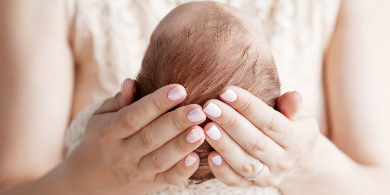 Mom holding her newborn baby