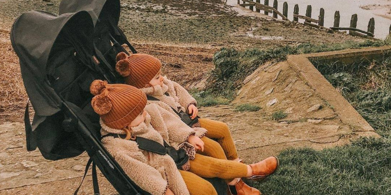 Two Children Sitting In Mountain Buggy Nano Duo Buggy 
