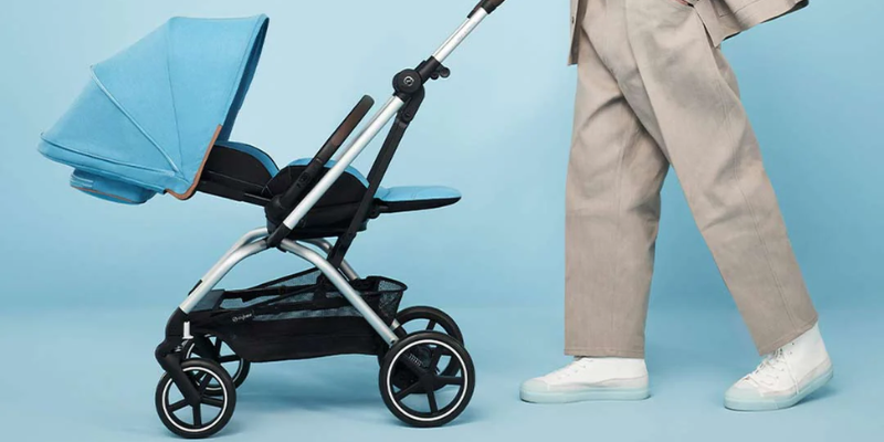 Man Pushing Cybex Eezy S Twist+2 Stroller in Blue