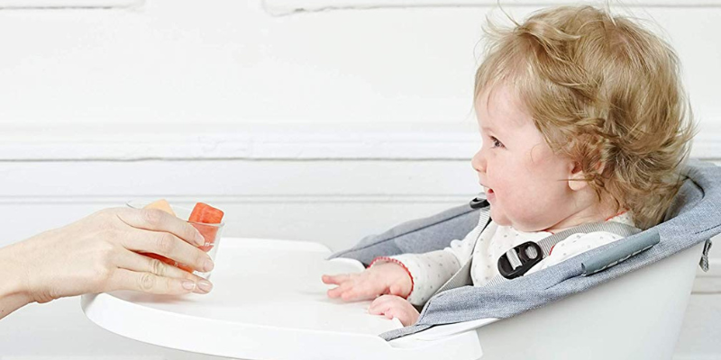 Baby siting in a Beaba Up & Down High Chair