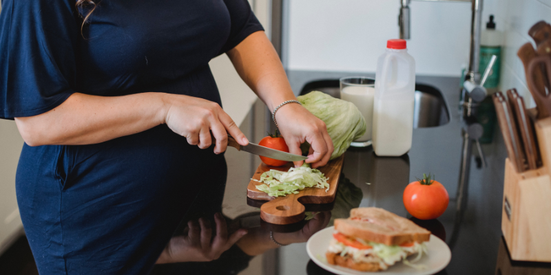 Pregnant Woman cooking