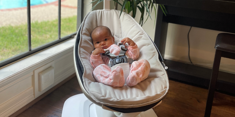 Baby in a 4moms mamaRoo Swing