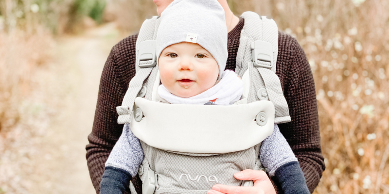 mother carrying baby in Nuna CUDL carrier