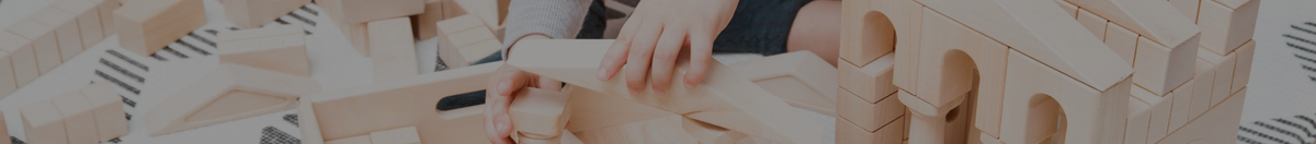 Child playing with wooden blocks