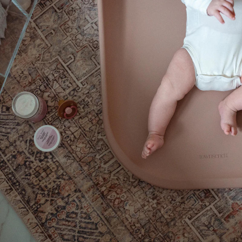 Townsend Avenue contoured changing pad with non-slip base in pink
